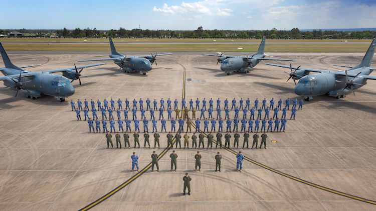 Members of No. 35 Squadron on the flight line with four C-27J Spartan battlefield air lifters at RAAF Base Richmond.