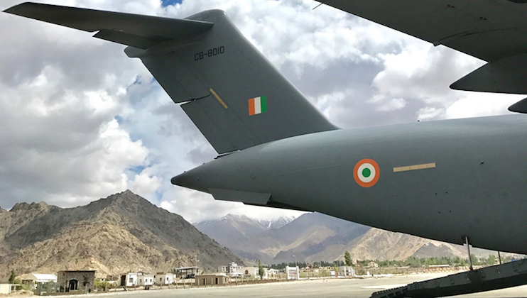 An Indian Air Force (IAF) C-17A Globemaster on the tarmac at Leh Airport, India, during a mission with Royal Australian Air Force (RAAF) C-17A aircrew observing high-altitude airport operations.