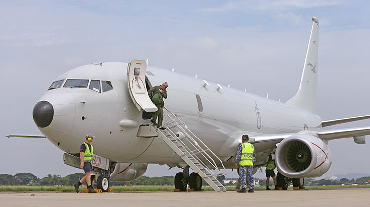 Crew disembarking a P-8A Poseidon at Royal Malaysian Air Force Base Butterworth in support of Operation GATEWAY