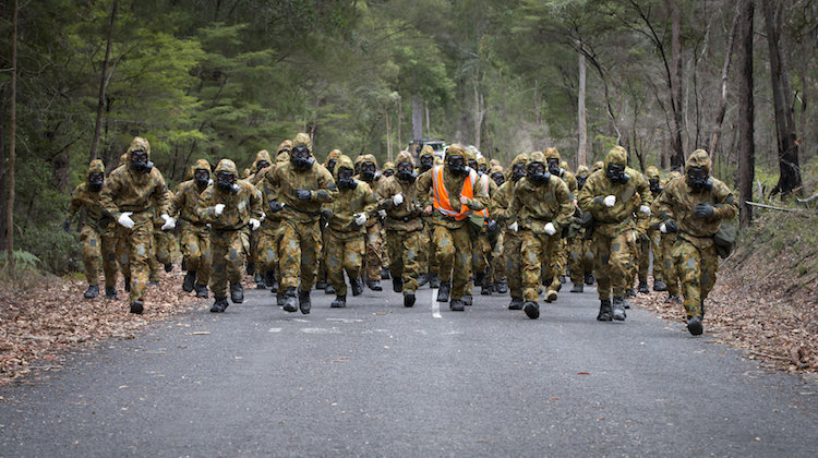 Australian Army soldiers from Task Group Taji Rotation 2 conduct pre-fatigue drills during CBRN (chemical, biological, radiological and nuclear environment) training as part of the task group's training camp at Kokoda Barracks, Canungra, Queensland, in September 2015.