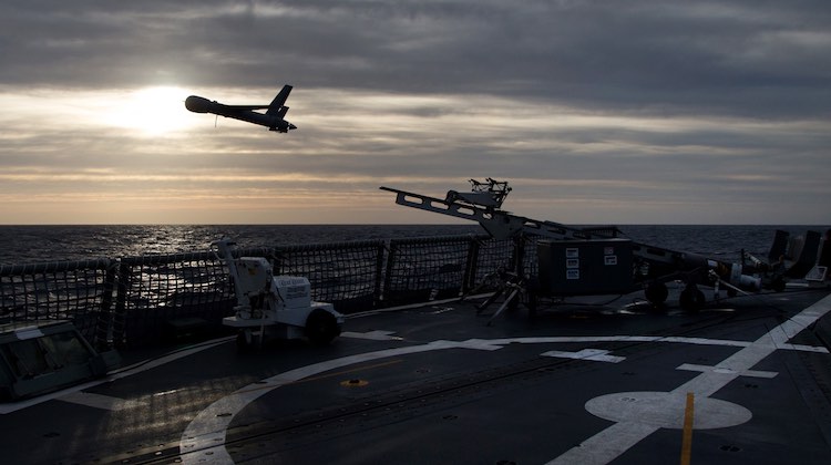 Scan Eagle, an unmmanned aerial vehicle launches from the flight deck of HMAS Newcastle during operational evaluation trials.