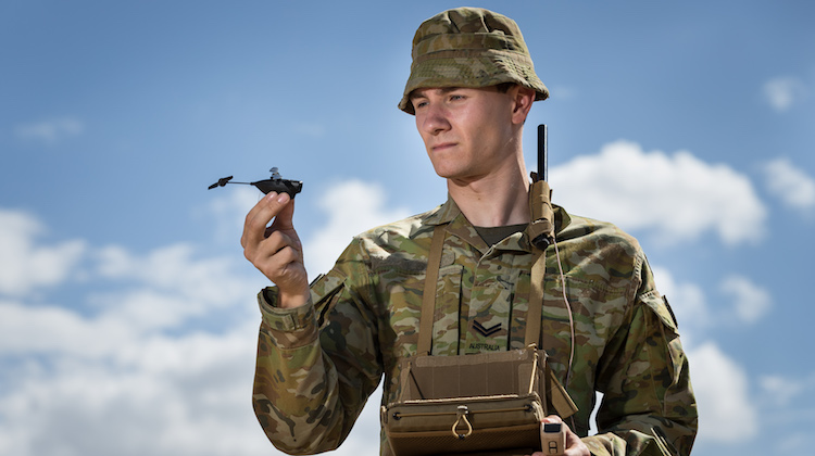 Australian Army soldier Corporal Joshua Collison with a PD-100 Black Hornet miniature unmanned aircraft vehicle at Lavarack Barracks, Townsville, on 17 November 2016.