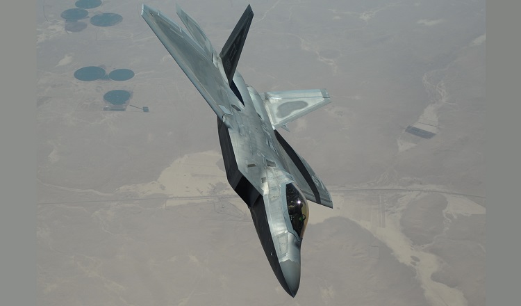 An F-22 Raptor from the 95th Expeditionary Fighter Squadron, Al Dhafra Air Base, United Arab Emirates, flies over Syria March 5, 2018. The F-22, a critical component of the Global Strike Task Force, is designed to project air dominance rapidly and at great distances, and defeat threats attempting to deny access to the Air Force, Army, Navy and Marine Corps. (U.S. Air National Guard photo by Staff Sgt. Colton Elliott)