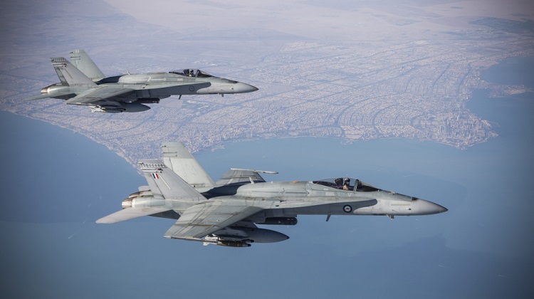 A pair of F/A-18A Hornets from Air Task Group 630 Strike Element flying in the Middle East Region during an Operation Okra mission. *** Local Caption *** Number 75 Squadron F/A-18A aircraft refuelling from a Royal Australian Air Force KC-30A Multi Role Tanker Transport aircraft, in support of Iraq Security Forces in the battle for Mosul, during the Squadrons deployment in 2016. The Air Task Group (ATG) of Operation OKRA, is operating at the request of the Iraqi Government within a US-led international coalition assembled to disrupt and degrade Daesh operations in the Middle East Region (MER). The ATG comprises six RAAF F/A-18A Hornet fighter aircraft, an E-7A Wedgetail airborne command and control aircraft, and a KC-30A Multi-Role Tanker Transport air-to-air refuelling aircraft. Additionally, the ATG has personnel working in the Combined Air and Space Operations Centre, and embedded with the Kingpin US tactical Command and Control Unit. The ATG is directly supported by elements of Operation ACCORDION including the Theatre Communications Group, Air Mobility Task Group, and the Combat Support Unit, whose mission is to provide airbase and aviation operational support to sustain air operations in the MER. There are up to 350 personnel deployed, at any one time, as part of, or in direct support of the ATG.