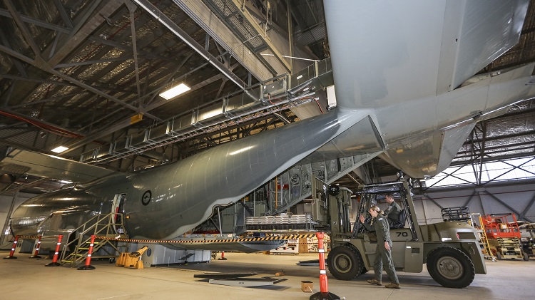 Sergeant Brodie Stewart (foreground) of No. 37 Squadron assists Flight Sergeant Liam Higgins with the loading of pallets onto the C-130J Fuselage Trainer at RAAF Base Richmond. *** Local Caption *** On 15 June 2018, a C-130J Hercules Fuselage Trainer was formally handed over at RAAF Base Richmond, providing the first accurate and dedicated cargo compartment training device for any RAAF C-130 variant since the Hercules introduction in December 2018. The device will be supported by CAE Australia and was constructed by Airbus Australia Pacific, with further assistance from Lockheed Martin, using the fuselages of two retired C-130H Hercules. The Fuselage Trainer will provide a dedicated training environment for Loadmasters as well as other personnel who utilise the C-130J, including Air Dispatchers, Air Movements personnel, and Aero Medical Evacuation specialists. Previously, personnel utilised retired C-130E Fuselage Hulks for training or worked on real C-130J airframes.
