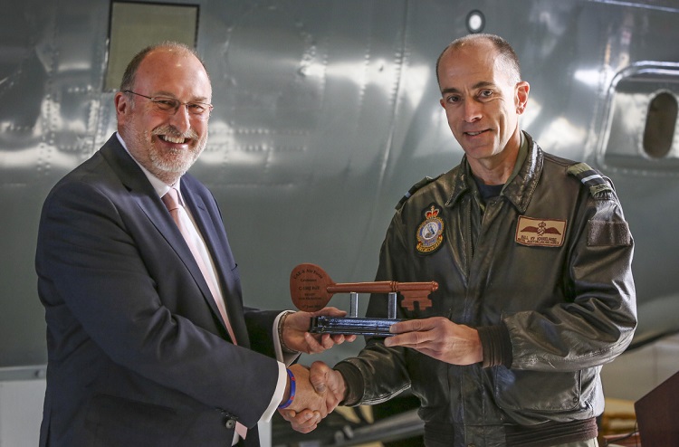 Ian Bell (left) from CAE Australia, presents Commander Air Mobility Group, Air Commodore William Kourelakos, with a key during the C-130J Hercules Fuselage Trainer hand over held at RAAF Base Richmond. *** Local Caption *** On 15 June 2018, a C-130J Hercules Fuselage Trainer was formally handed over at RAAF Base Richmond, providing the first accurate and dedicated cargo compartment training device for any RAAF C-130 variant since the Hercules introduction in December 2018. The device will be supported by CAE Australia and was constructed by Airbus Australia Pacific, with further assistance from Lockheed Martin, using the fuselages of two retired C-130H Hercules. The Fuselage Trainer will provide a dedicated training environment for Loadmasters as well as other personnel who utilise the C-130J, including Air Dispatchers, Air Movements personnel, and Aero Medical Evacuation specialists. Previously, personnel utilised retired C-130E Fuselage Hulks for training or worked on real C-130J airframes.