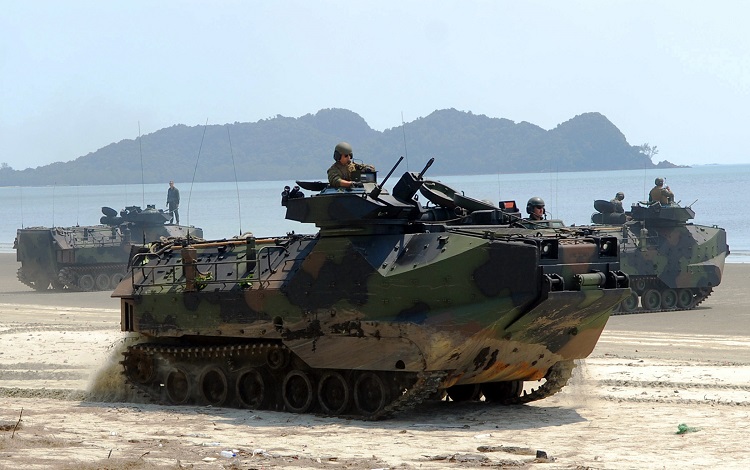 090629-N-5207L-232 RESANG, Malaysia (June 29, 2009) Amphibious assault vehicles transport U.S. Marines and Malaysian Army soldiers from the 9th Royal Malay Regiment along Resang Beach during a Cooperation Afloat Readiness and Training (CARAT) Malaysia 2009 joint amphibious landing exercise. CARAT is a series of bilateral exercises held annually in Southeast Asia to strengthen relationships and enhance the operational readiness of the participating forces. (U.S. Navy photo by Mass Communication Specialist 1st Class Bill Larned/Released)