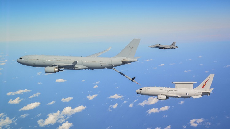 An RAAF KC-30A Multi Role Tanker Transport, E-7A Wedgetail and an F/A-18F Super Hornet fly in formation as they transit to the battlespace on Operation OKRA. *** Local Caption *** The Air Task Group (ATG) is deployed on Operation OKRA and is operating at the request of the Iraqi Government with a US-led Global Coalition assembled to disrupt and degrade Daesh operations in the Middle East Region (MER). The ATG comprises six RAAF F/A-18F Super Hornet fighter aircraft, an E-7A Wedgetail airborne command and control aircraft, and a KC-30A Multi-Role Tanker Transport aircraft. Additionally, the ATG has personnel working in the Combined Air and Space Operations Centre, and embedded with the Kingpin US tactical command and control unit. The ATG is directly supported by elements of Operation ACCORDION including the Theatre Communications Group, Air Mobility Task Group, and the Expeditionary Airbase Operations Unit. There are up to 300 Australian Defence Force personnel deployed, at any one time, as part of, or in direct support of the ATG.