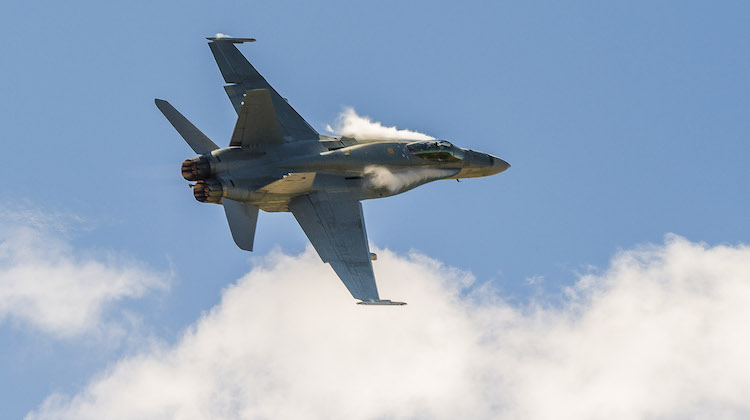 A Royal Australian Air Force F/A-18 Hornet conducts a Close Air fly over during the Darwin V8 Supercars at Hidden Valley motorsport complex on the 18th of June, 2017.